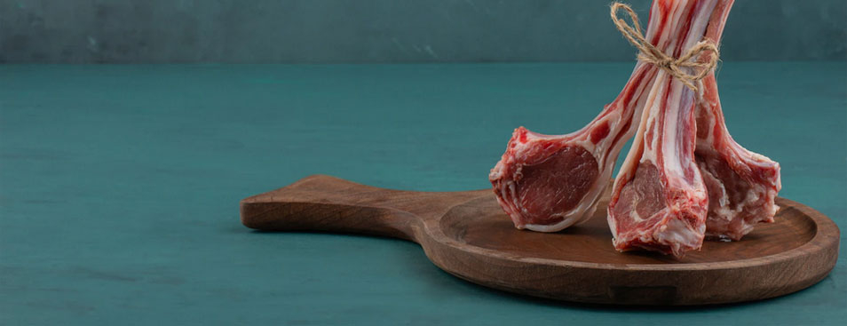 Raw Lamb Chops on Wooden Board